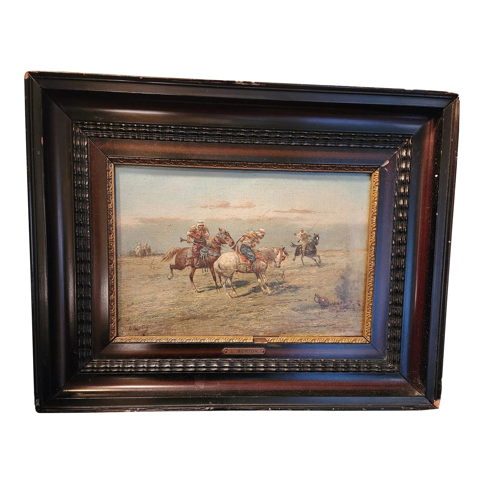 19th Century Orientalist French Oil on Canvas, Framed: Canvas painting by Louis Berton depicting three Arab men on horseback inspecting a bonfire's remnants as more men approach from the background of the scene. Signed at lower left. Mounted in a wooden
