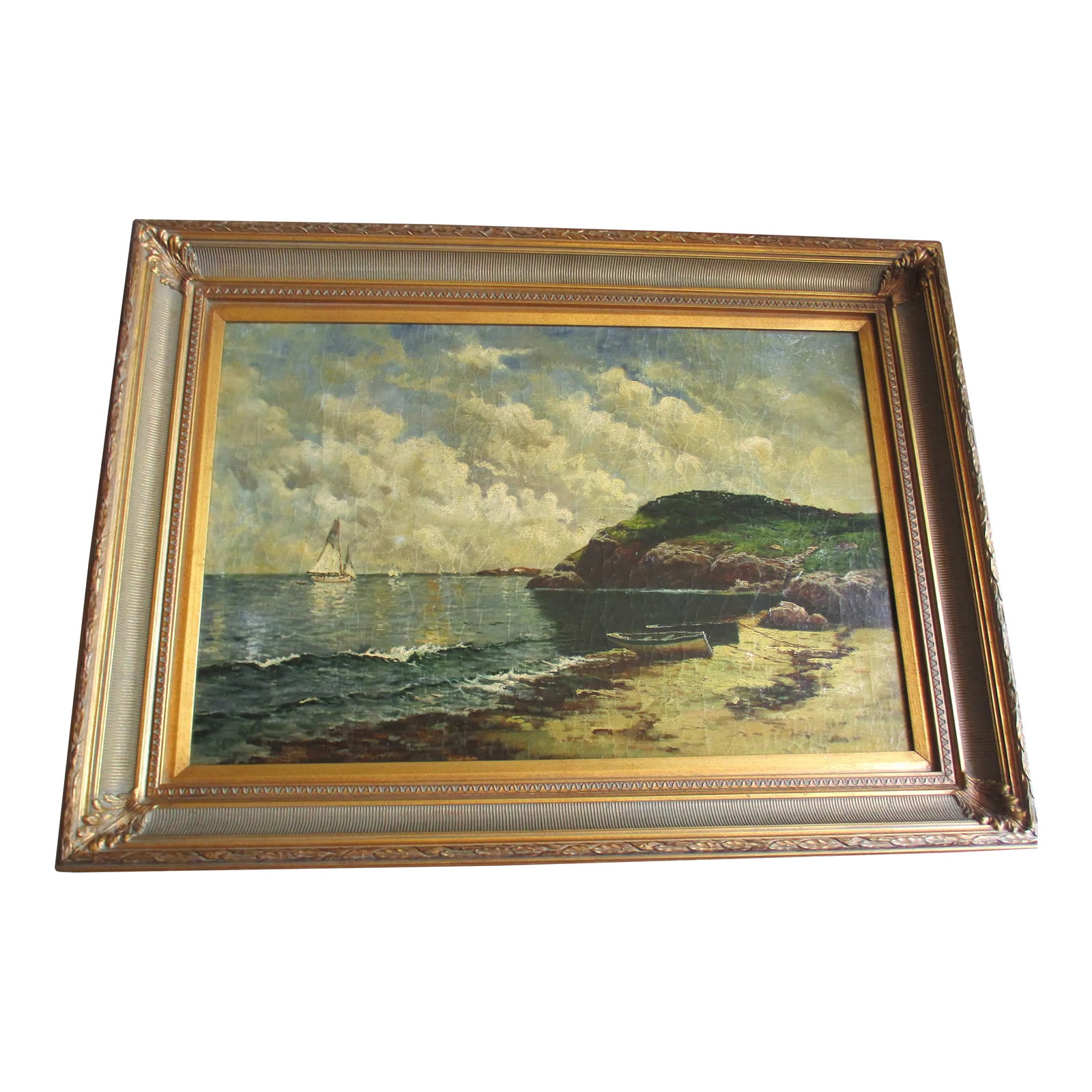 1980s Vintage Oil on Board in Gilt Wood Frame: This is a Magnificent! Fine Vintage Oil on Board with a Fabulous Ornate Gold Frame. The Oil is on a Beveled Edge Wood Plank and has a Lovely Scene of a Sailboat off the shore in the distance and a can