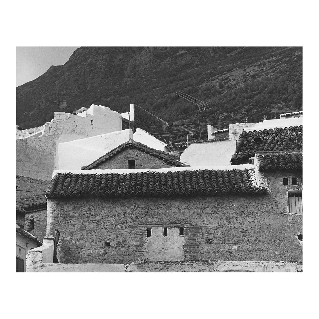 Moroccan Roof Tiles Photograph by Don Ware: 1976 black and white photo by Los Angeles, California photographer Don Ware of Tetouan, Morocco. Titled, dated and bearing Ware's studio stamp on the back. Condition: Alterations: Original Condition