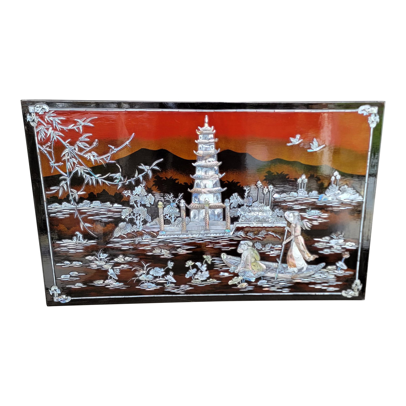 Wall Plaque Pagoda With Mother of Pearl & Lacquer Vietnamese 1970's: Vietnamese carved Mother-of Pearl and lacquer wall plaque. Featuring a Pagoda at center with flora, water and women in boat. Circa. 1970's. 19.5 inches high. 31.5 inches wide. .5 inches deep.