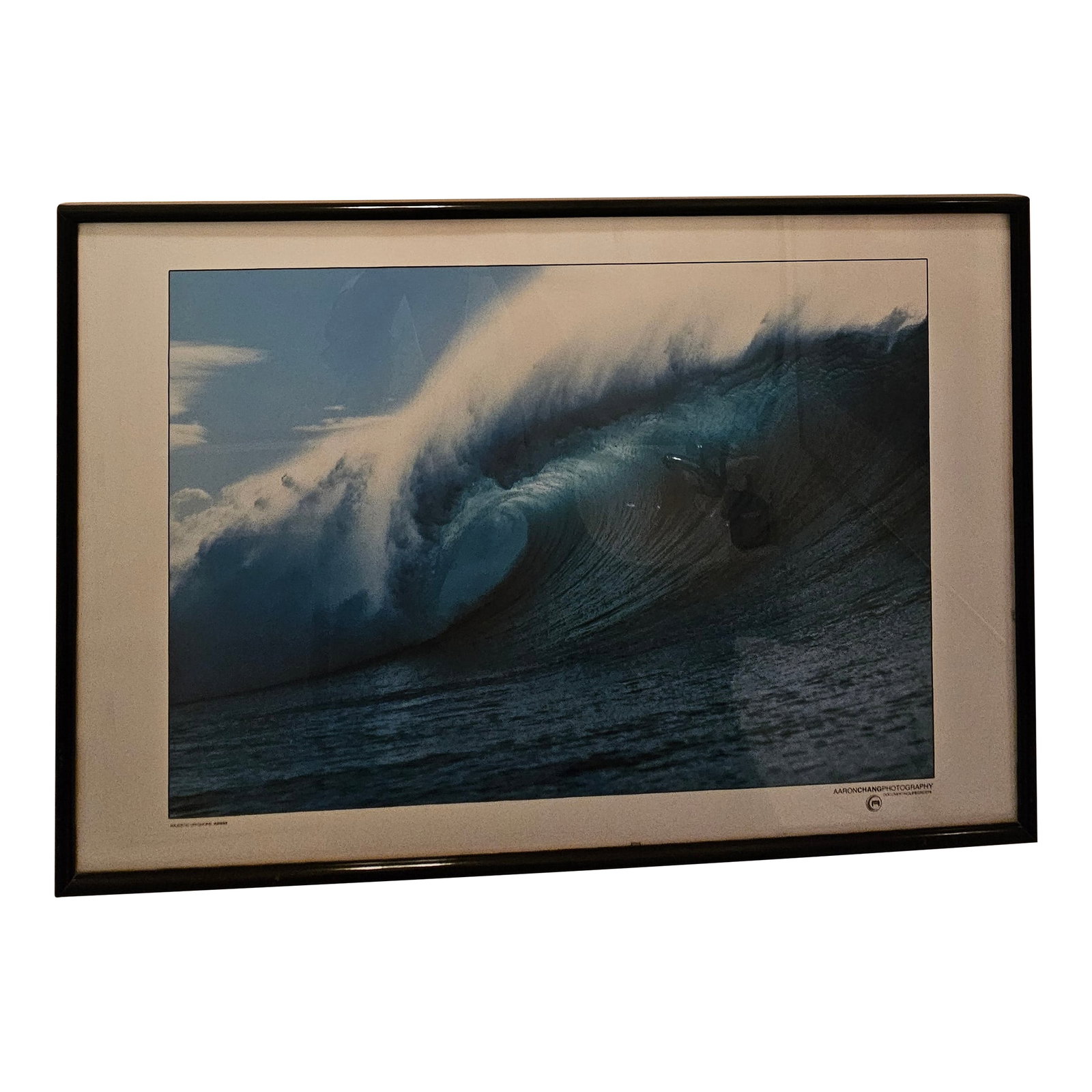 Aaron Chang Print Titled Majestic Offshore Hawaii: Aaron Chang is a photographer known for his surfing and ocean photography. As one of the first photographers to capture waves with a wide angle lens from the water, his photos are iconic. This poster