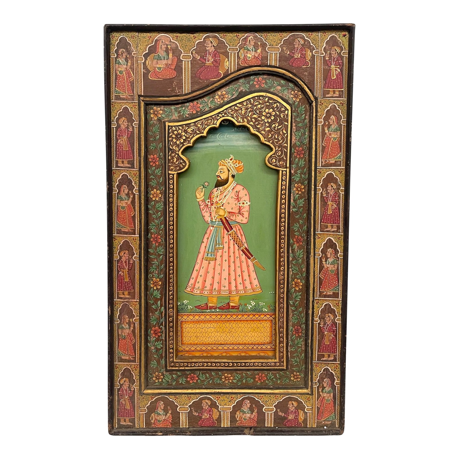 1970s Hand-Painted Indian Mughal-Style Portrait Panel on Wood: A beautifully hand-painted Indian Mughal-style portrait panel on wood, featuring an intricately rendered noble figure set within an ornate arched frame. The central figure is depicted in traditional