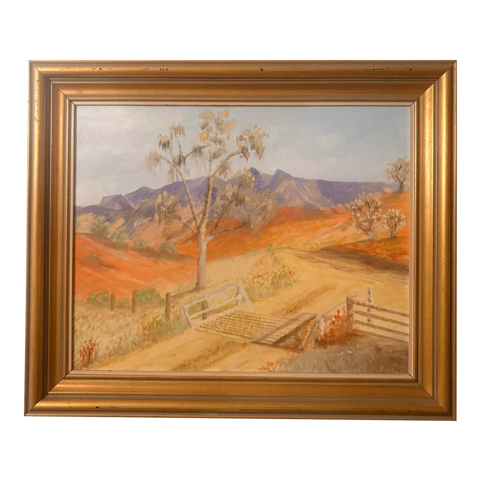 Late 20th Century California High Desert Landscape Oil on Canvas, Signed by Artist: This original oil painting beautifully captures the magical effect that light has on California's high desert landscapes, rendering the terrain and vegetation in deep pastels of golden yellow fields,
