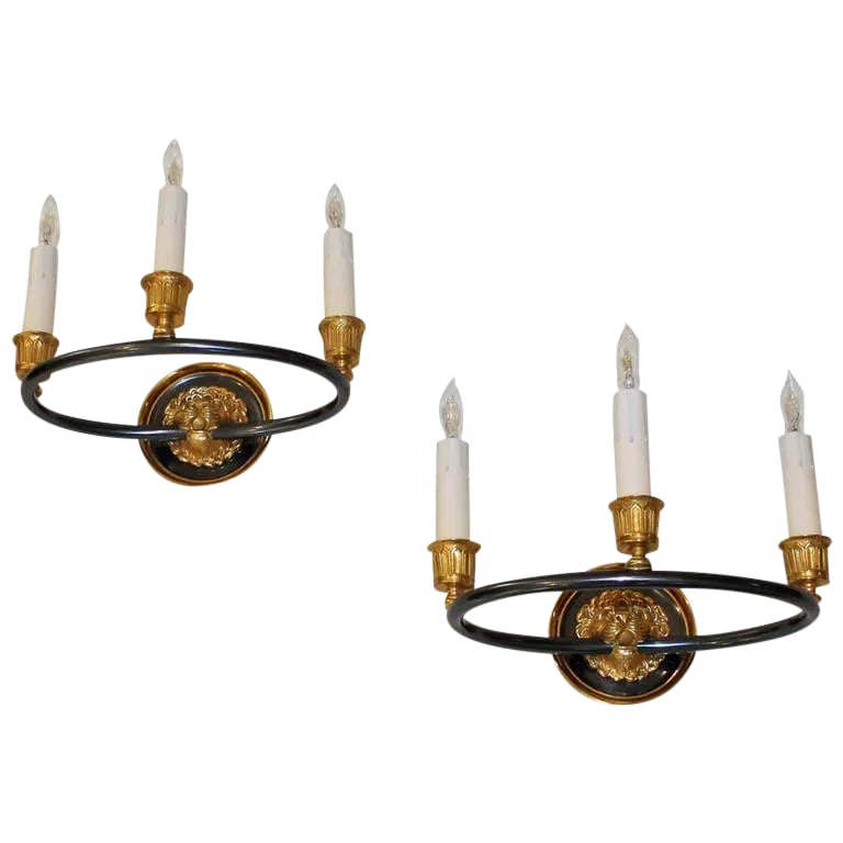 1960s Vintage Maison Bagues French Empire Style Lion Dore Wall Sconces - A Pair: This is a pair of beautifully detailed Maison Bagues French Empire style 3 light wall sconces. Sconces feature lion motif backplates, style #17809. Gilt bronze and gun metal finish. Some patina to