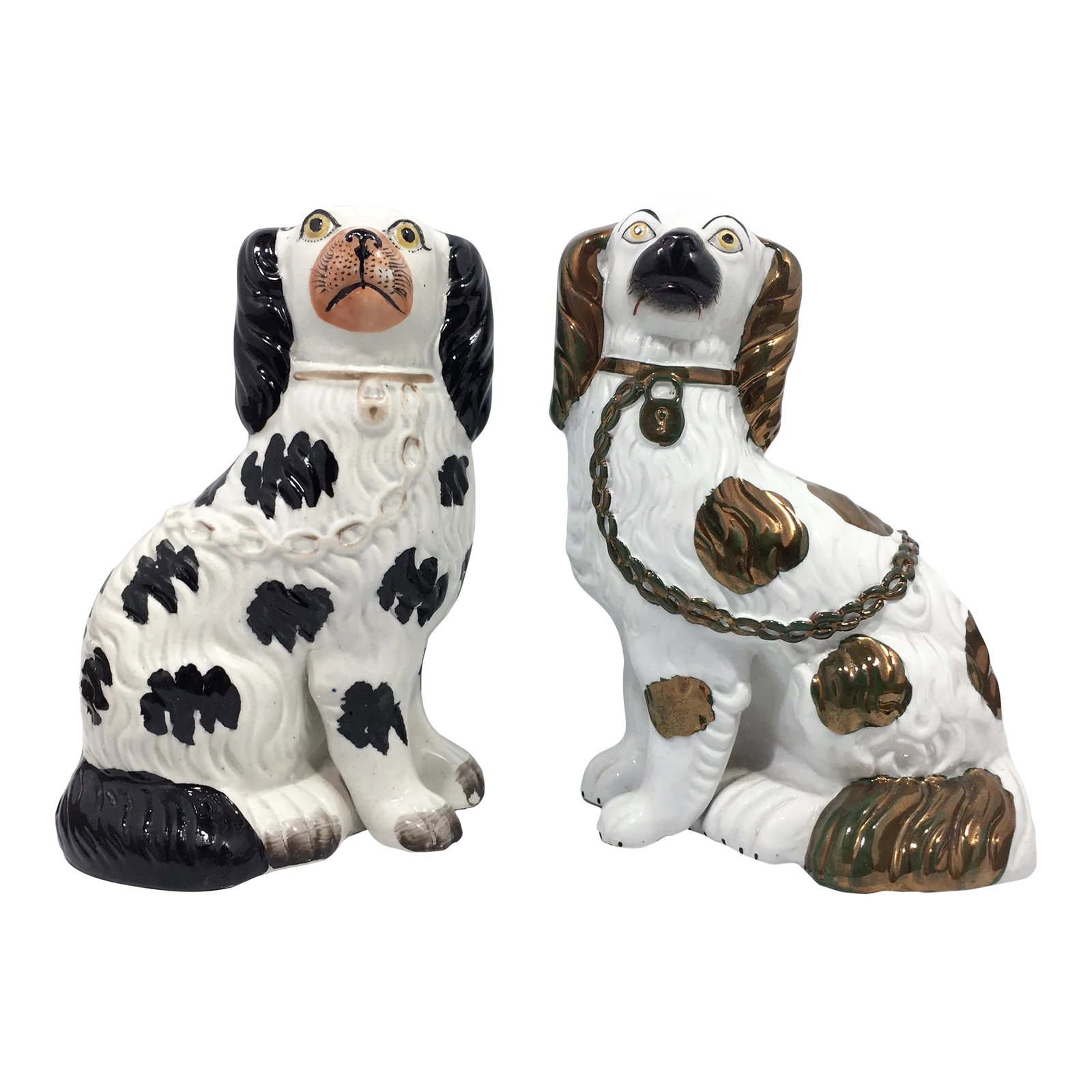 English Victorian Staffordshire Disraeli Black and Copper Lustre Spaniels - a Pair: Left: Antique English Victorian Staffordshire Disraeli Black and white Spaniel decorated "in the round", circa 1860. The muzzle is a pink tone with yellow eyes. Right: Later, circa 1880, Victorian