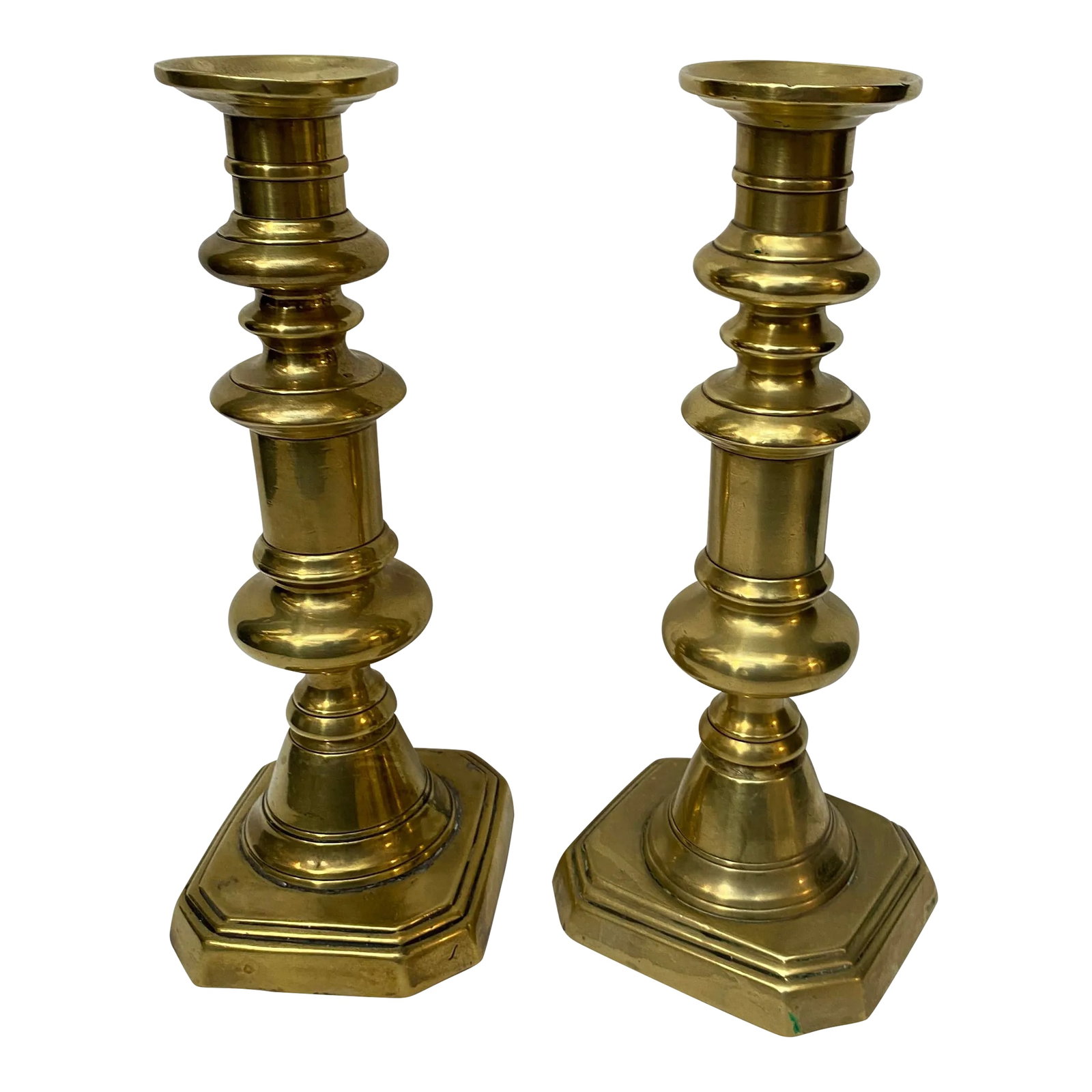 Antique English Brass Candlesticks - a Pair: Pair of large English brass pushup candlesticks. Larger than most, these are 10 3/4 inches tall each. Unmarked. Condition: Alterations: Original Condition Unaltered Imperfections: Some Imperfections