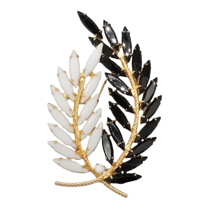 Vintage 1960s Signed Napier Marquise Rhinestone Leaves Brooch: This is part of Chairish's Costume Jewelry assortment. 1960s goldtone prong set marquise faux-onyx and white rhinestone leaves brooch with security clasp. Marked "Napier." Measures: 3 inches long by