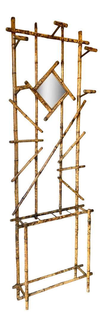 Vintage Mid-Century Bamboo Hall Tree: A wonderful Vintage Mid-Century Bamboo Hall Tree features a diamond shaped mirror and five bamboo hooks allowing for function and seamless style along with a slated base to hold umbrellas. The