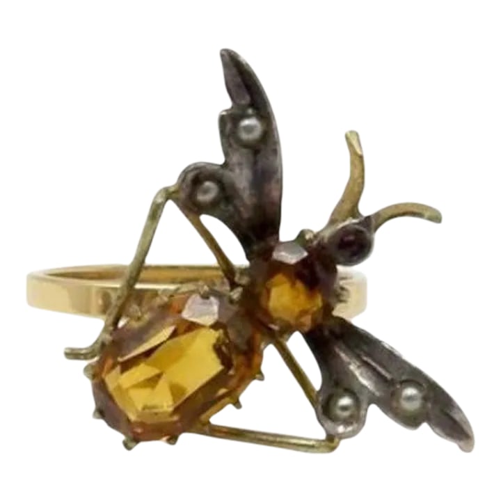Art Nouveau 14K Gold and Silver Insect Ring with Topaz Size 7.5: This is part of Chairish's Fine Jewelry assortment. Perched on a 14k yellow gold band is a charming winged bug made of sterling silver, 9K gold, topaz, pearls, and a garnet. The bug dates to the
