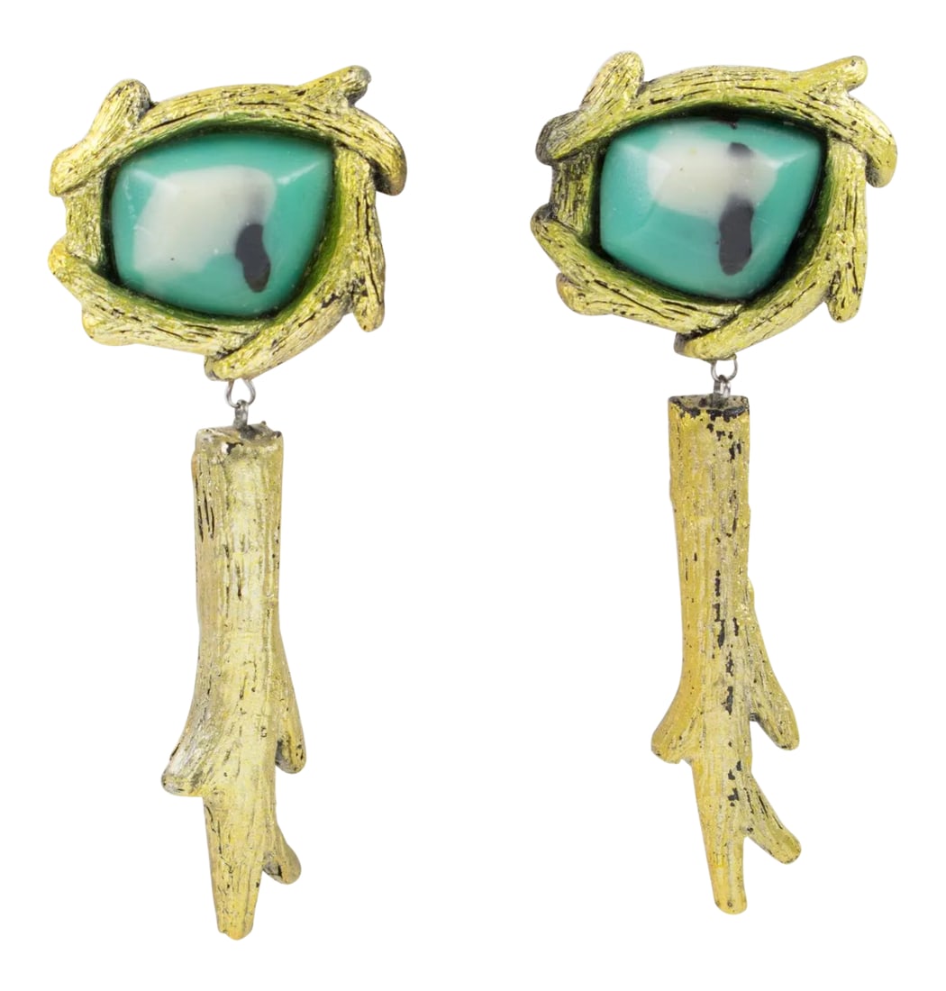 Mary Oros Oversized Gilt Cast Resin Drop Clip Earrings: These stunning oversized clip-on earrings were designed by Mary Oros, a Californian artist, in the 1980s. They feature an organic feel dangling shape in cast resin with gilded metal coating topped wit