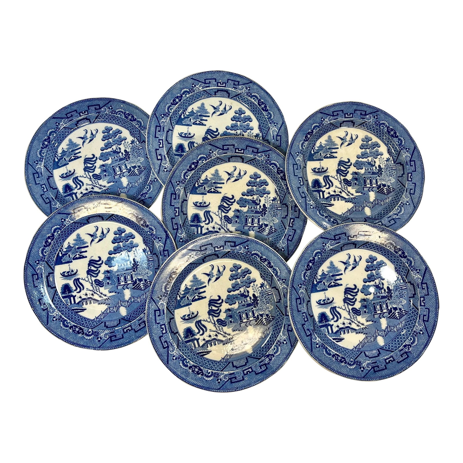 Antique Set of 7 Blue Willow Luncheon Plates Made in England - Circa 1900: Antique Set of 7 Blue Willow Luncheon Plates Made in England - Circa 1900. Each measures 9 1/2" W x 9 1/2" D x 1" T Condition: Alterations: Original Condition Unaltered Imperfections: Some Imperfectio