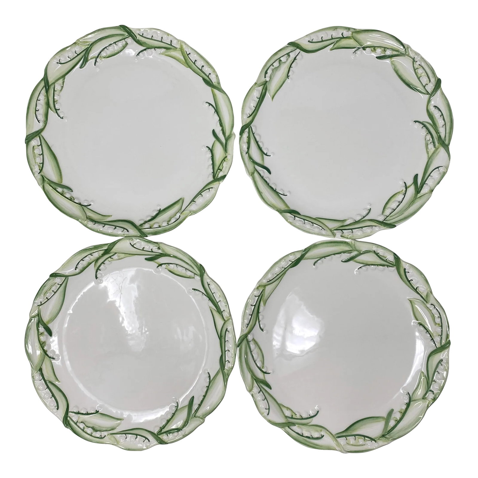 Lily of the Valley for the Mane Lion Dinner Plates, Set of 4: Adorned with the delicate and timeless Lily of the Valley motif, this dinner plate brings the charm of nature to your dining table. The intricate design showcases the beauty of Italian artistry, makin