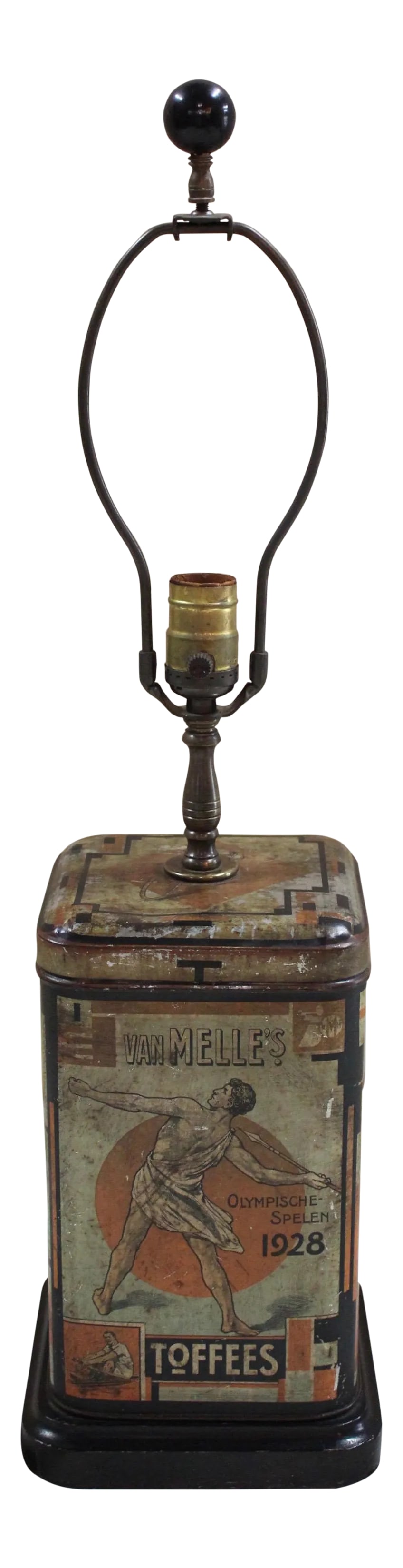 1928 Olympic Dutch Toffee Canister Lamp: Table lamp made from a commemorative toffee canister with nude male athletes from the 1928 Olympics in Amsterdam. Tin height is 10". Condition: Alterations: Original Condition Unaltered Imperfections: