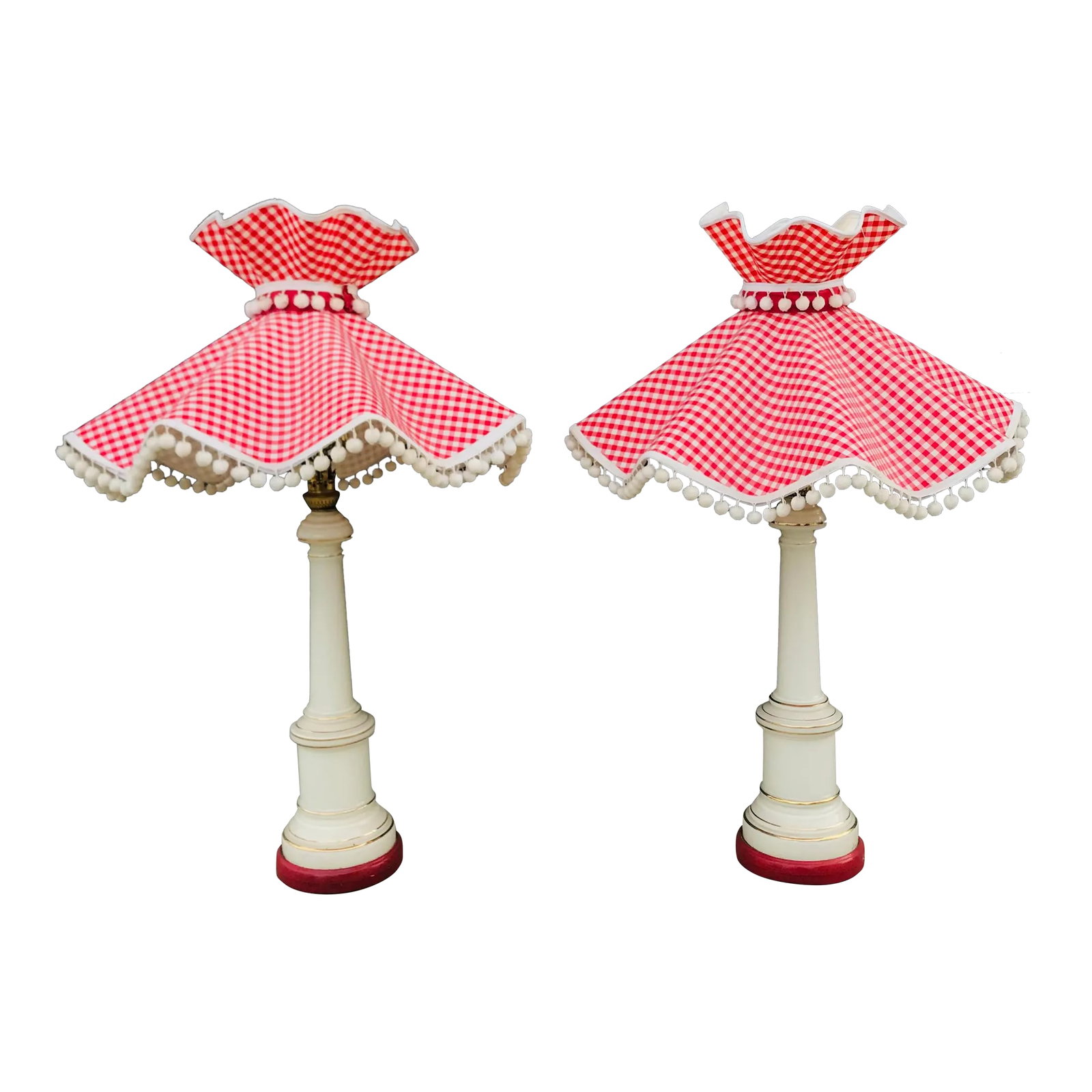 A Pair of Cottage-Core Stiffel Attributed Brass and White Porcelain Table Lamps With Gingham Red Sha: This charming duo hit all the right notes! Lamps have painted red (over brass) on the bases that tie in perfectly to the sweet pompom gingham shades. Original lamps are attributed to Stiffel but bear