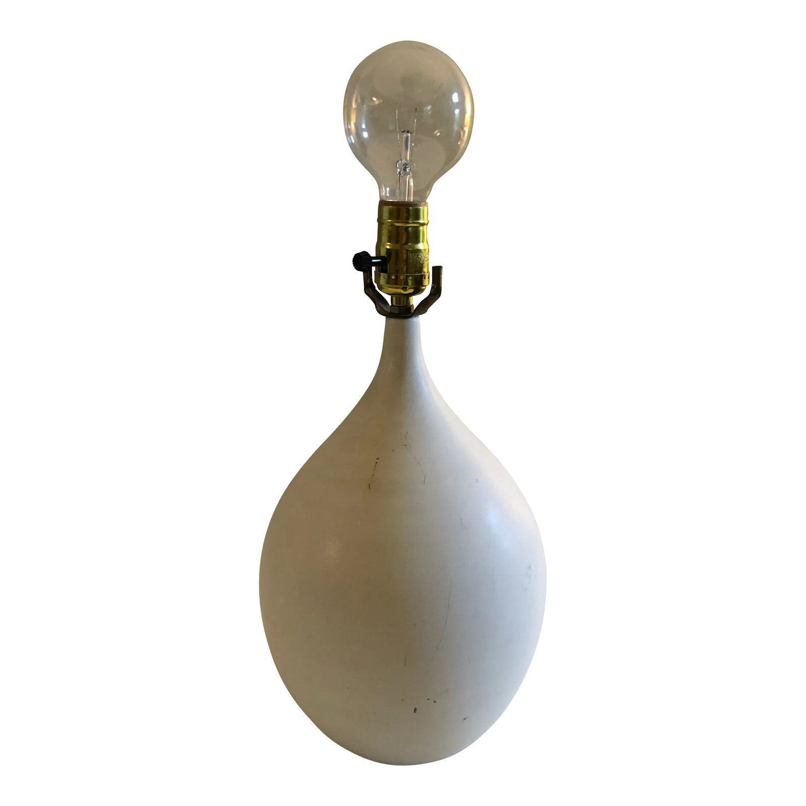 Vintage White Mid-Century Bone Stoneware Pottery Lamp in Manner of Lotte: Vintage mid-century lamp in the manner of Lotte Gunnar Bostlund in a matte white glaze.. Some scuffs and scratches as pictured. 15" to the top of the socket with 9" diameter. Will need a new shade