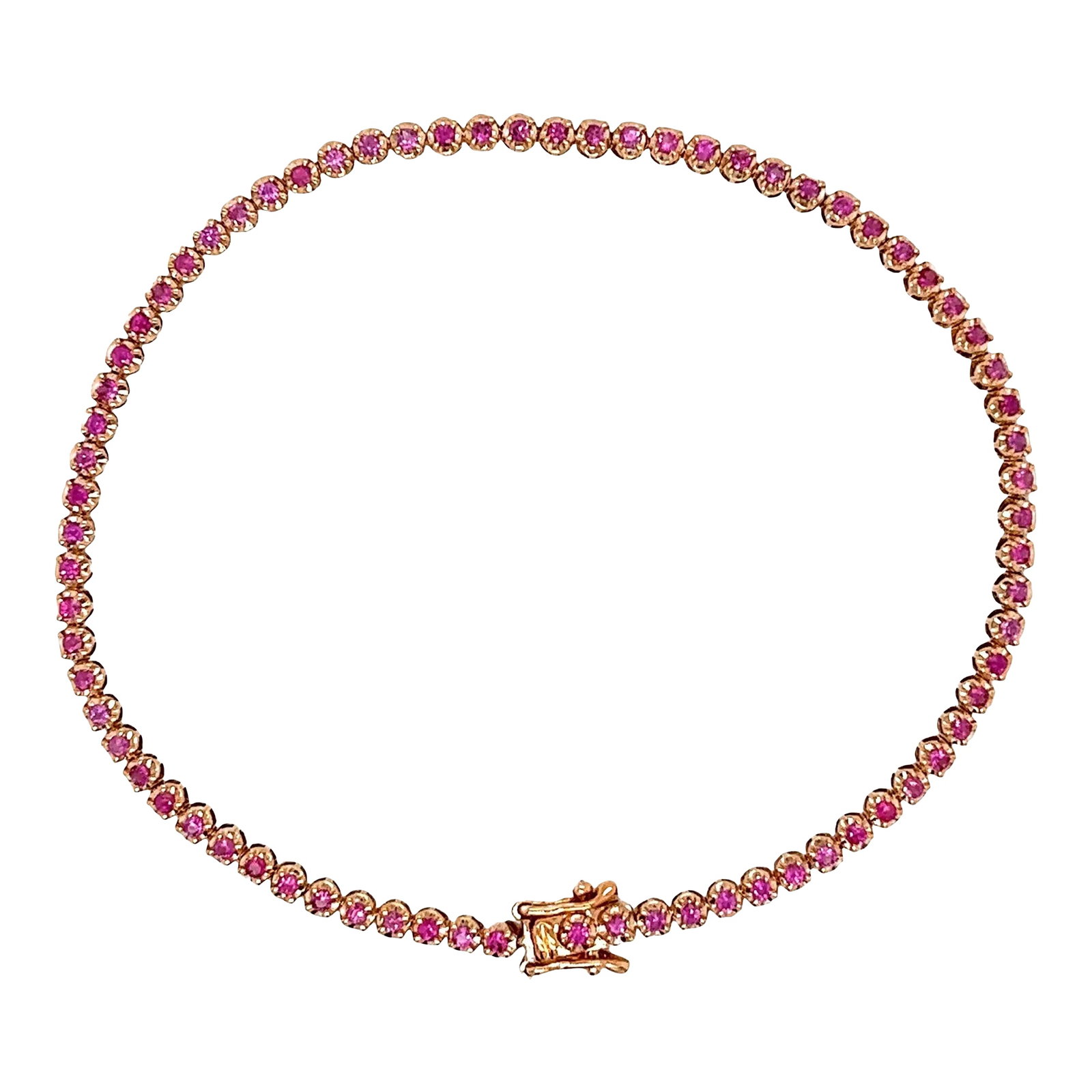 Natural Round Cut Pink Sapphire Tennis Bracelet in 14K Rose Gold: Pink sapphire tennis bracelet, featuring 0.93 carats in round-cut natural pink sapphires set in 14-karat rose gold. The 7-inch length and 2.4mm in width comes with a secure box closure and double