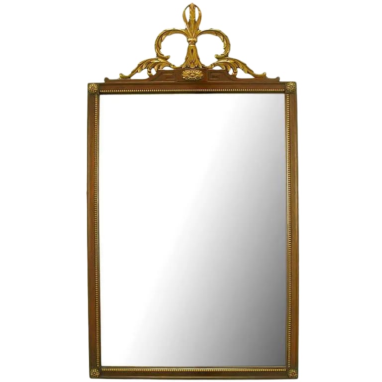 Carved and Parcel Giltwood Italian Neoclassical Style Mirror: Early 20th century carved, parcel giltwood and gesso Italian neoclassical style mirror. Carved wood frame with beaded border and corner rosettes. Giltwood and gesso crown with Greek key and acanthus