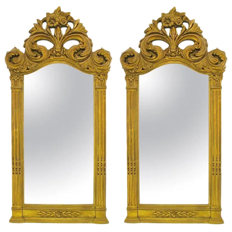 Two 55" Tall Rococo Style Gilt Composition Mirrors: Large and impressive pair of aged gilt Rococo style framed mirrors with pierced and foliate detailed crowns. Could be used over a pair of consoles or in a double vanity bathroom. Condition: