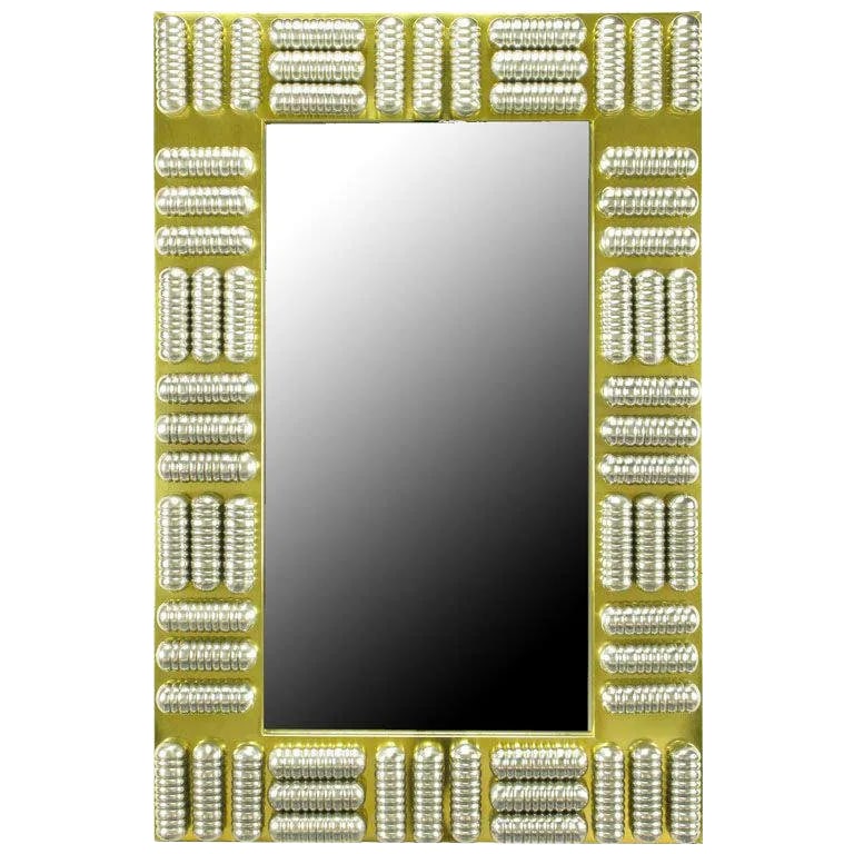 Circa 1970s Brass & Spun Aluminum Custom Wall Mirror in the Manner of C.Jere: Custom made wall mirror with brass wrapped wood frame and a series of polished and ribbed aluminum enclosed tubes. Each tube is wired to through the frame in two places. The mirrored glass is