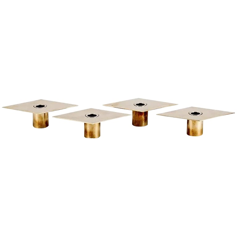Set of 4 Candleholders by Sigurd Persson: Set of four rhomb-shaped brass Candleholders designed by Sigurd Persson (1914-2003) Sweden. Solid brass cylindrical base with polished rhomb plate. Each example marked: SIG.P Condition: Alterations: