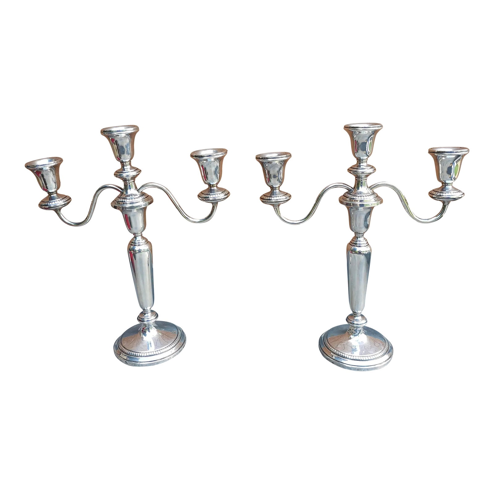 Pair of Weighted Sterling Silver Convertible Three-Light Cadelabra: Pair of Weighted Sterling Silver Convertible Three-Light Cadelabra. Base is 4" in diameter. 10" in width, 8.5" in height without arms and 12" in height with arms. Condition: Alterations: Original