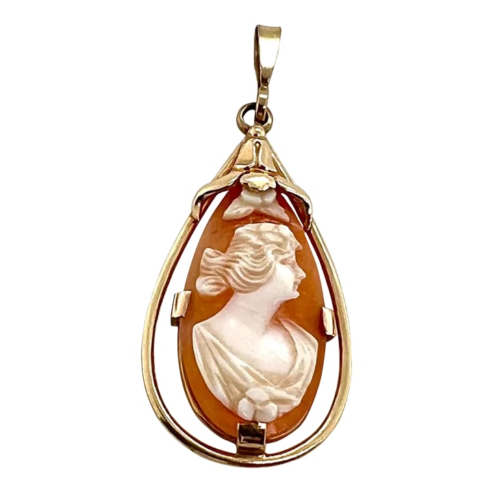 Vintage 10k Gold Carved Shell Pendant: This is part of Chairish's Fine Jewelry assortment. A fine 10K gold pendant featuring a tear-shaped carved shell cameo. The cameo depicts a profile of a female. She is set within an openwork bezel.