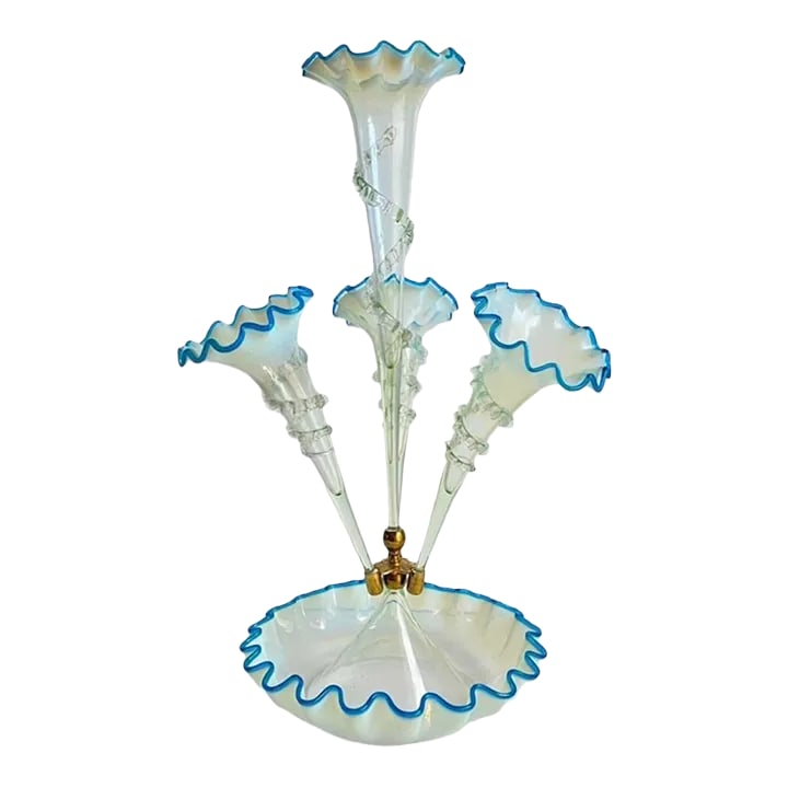Victorian Epergne Blue Vaseline Glass Antique Ruffle Art Glass Vase: A Victorian blue vaseline glass epergne, having a central stem and three lily form trumpets with turquoise blue petals modulating to white, applied spiral trailing foliate motifs, a circular frilled