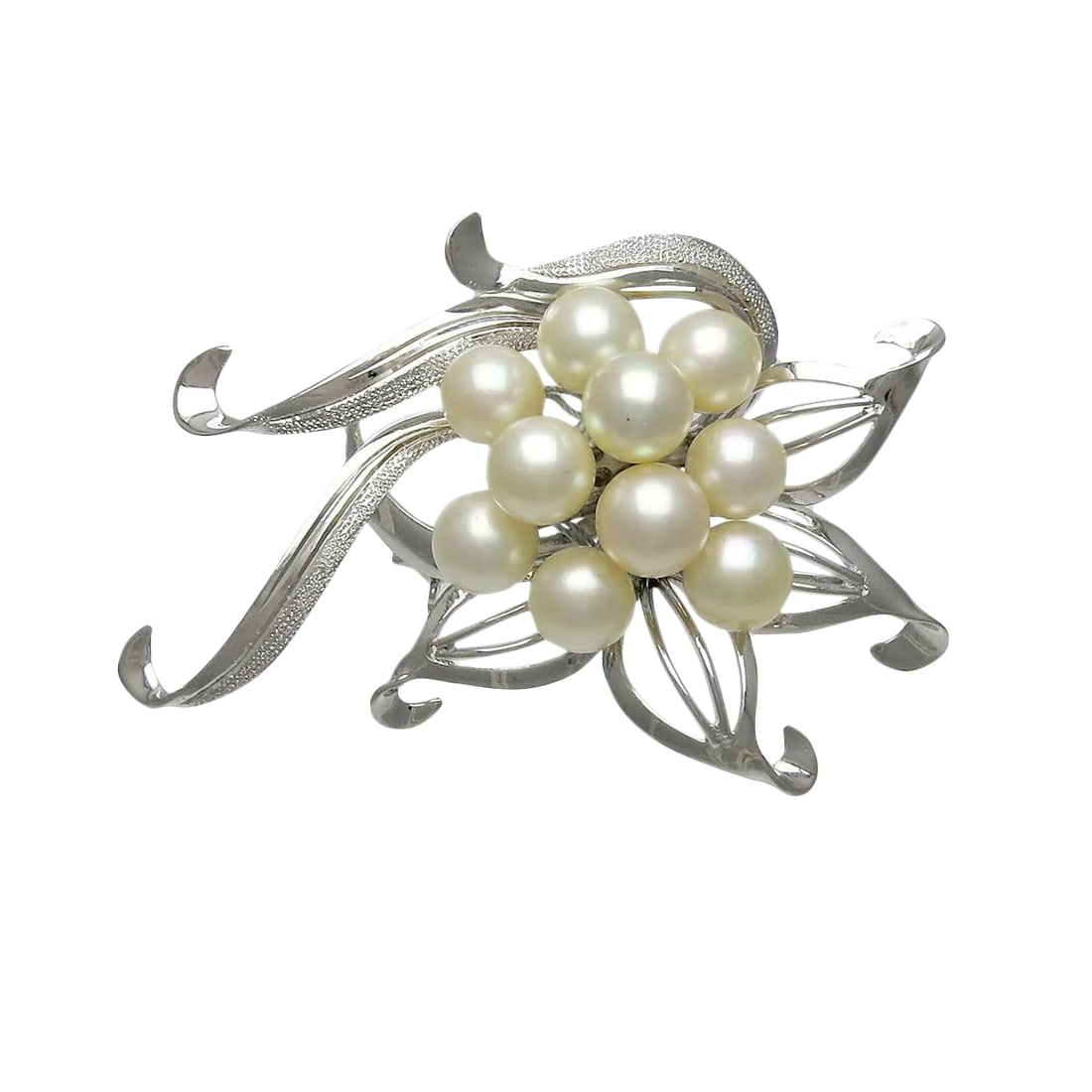 Vintage Sterling Silver Culture Pearl Brooch: A wonderful Vintage sterling silver and large Japanese Akoya cultured pearl brooch. The pin has a total of ten pearls, with rich color and fine luster. The brooch is marked silver and can be worn in