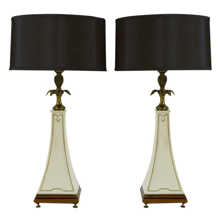 Stiffel Porcelain Obelisk & Decorative Brass Table Lamps - a Pair: Pair of Stiffel neoclassical table lamps with Lenox porcelain obelisk bodies detailed in gilt edging. Wood base with brass feet, brass decorative pineapple and leafed spacer. Brass stem and cup with