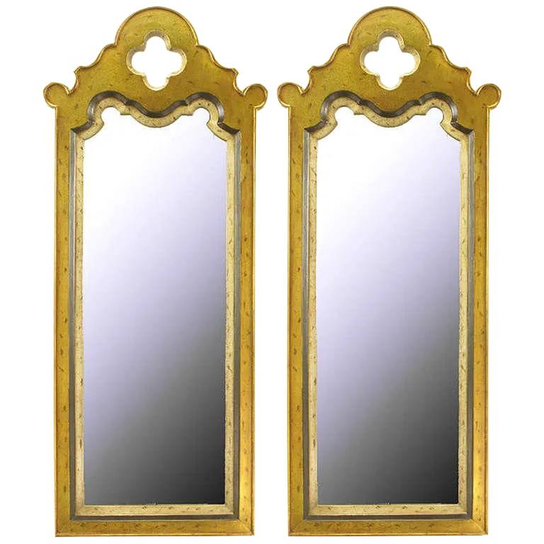 Gilt Moroccan Style Wall Mirrors - a Pair: Pair of cast resin Moorish design mirrors with patinated gold and silver leaf finish. Tall and narrow with inset frame and quatrefoil top opening. Condition: Alterations: Original Condition Unaltered