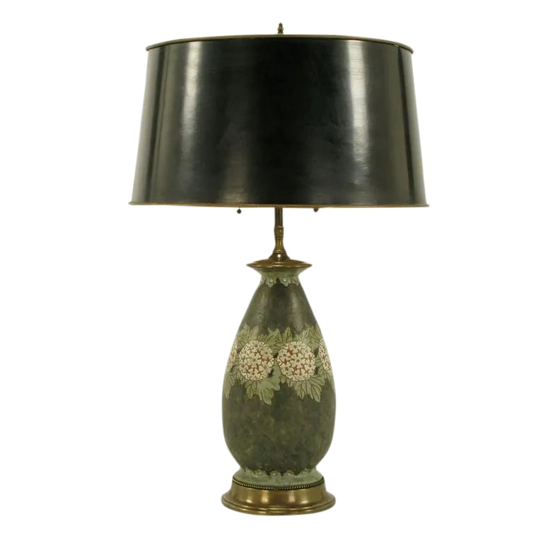 Hand Thrown Pottery Table Lamp With Hydrangea Decoration: Hand thrown pottery table lamp. Vase form body with brass base and cap along with double cluster sockets. Black with green glazed finish over red clay with incised hydrangea and foliage. Sold sans sha