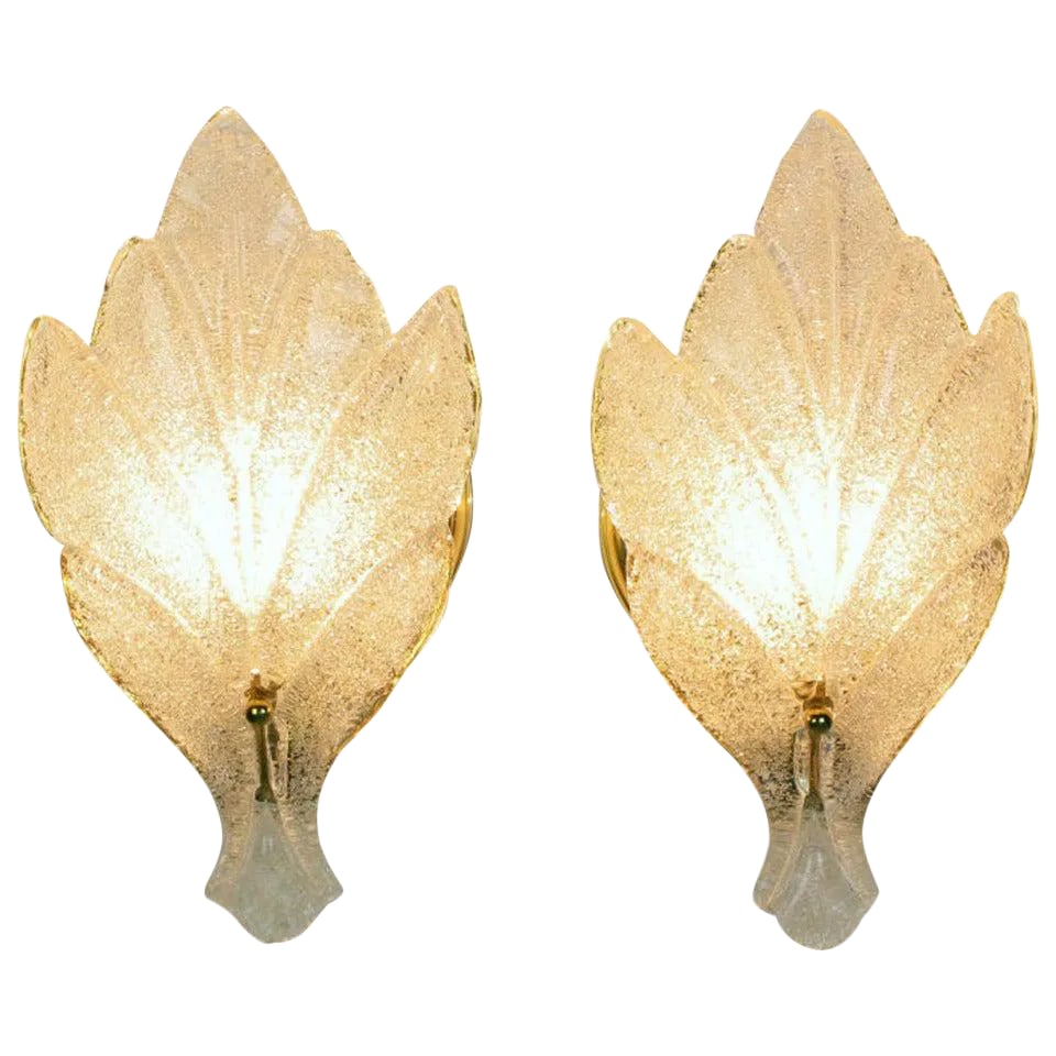 Murano Glass Maple Leaf Wall Sconces - a Pair: Pair of Murano glass wall sconces consisting of a single stylized maple leaf and a circular brass wall plate with a single socket and mount. Similar in style, quality and size to sconces by Barovier &
