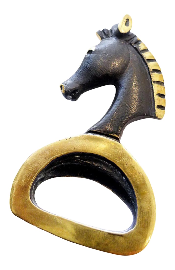 Horse Head Bottle Opener by Walter Bosse: Patinated brass bottle opener designed by Walter Bosse, featuring a horse head design. Signed on back Condition: Alterations: Unknown Imperfections: Some Imperfections Condition Notes: Excellent - Min