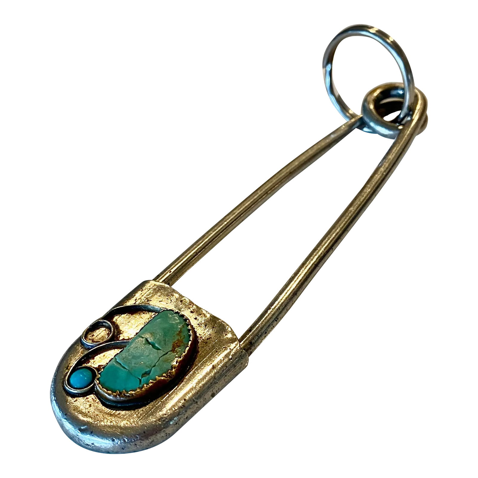 Navajo Old Pawn Safety Pin Key-Tag in Sterling Silver: A signed Risdon Key-Tag vintage Navajo Old Pawn key tag that has a hand-bezel-set turquoise stones embellishing an extra large safety pin in solid sterling silver. This piece is signed en verso with