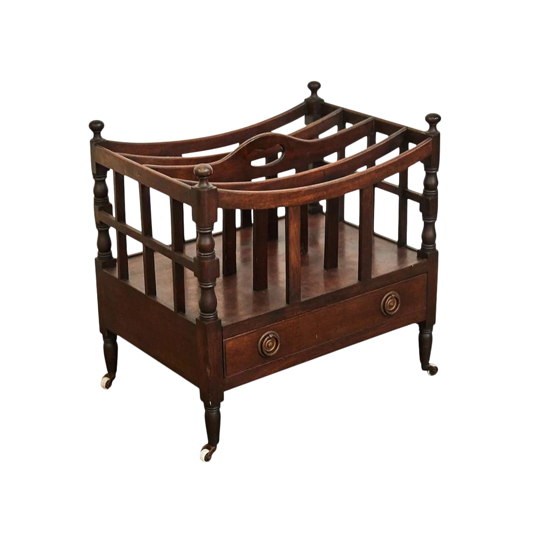 Regency Canterbury Magazine Rack: This beautifully designed Regency period Canterbury is made from Mahogany with brass drop pull fixtures on the lower drawer. The piece stands on tapered feet with casters on ceramic wheels.