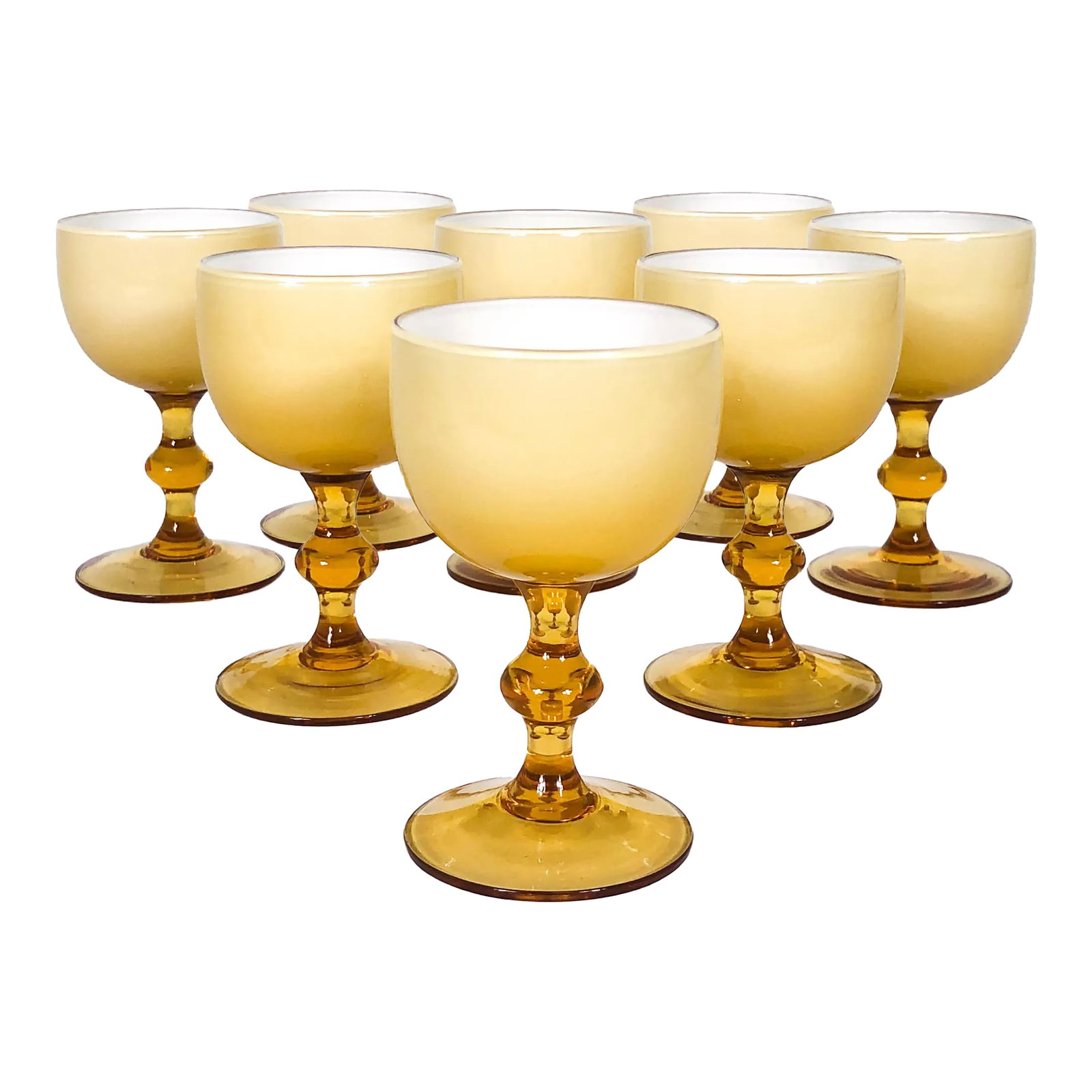 Vintage Carlo Moretti Butterscotch Cased Glass Aperitif Glasses - Set of 8: A set of eight cased glass aperitif glasses by Carlo Moretti. Made in Italy, these mid-century glasses have butterscotch colored exteriors with white interiors. Each glass holds 4 oz. Matching wine
