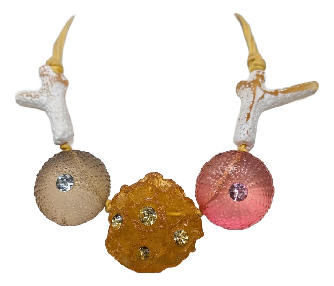 Vintage Signed Ugo Correani Italy Sea Urchin Necklace: 1980s goldtone one grey Lucite sea urchin shape with a round clear rhinestone center, one pink Lucite sea urchin shape with a round pink rhinestone center with an orange Lucite sea sponge shape with m
