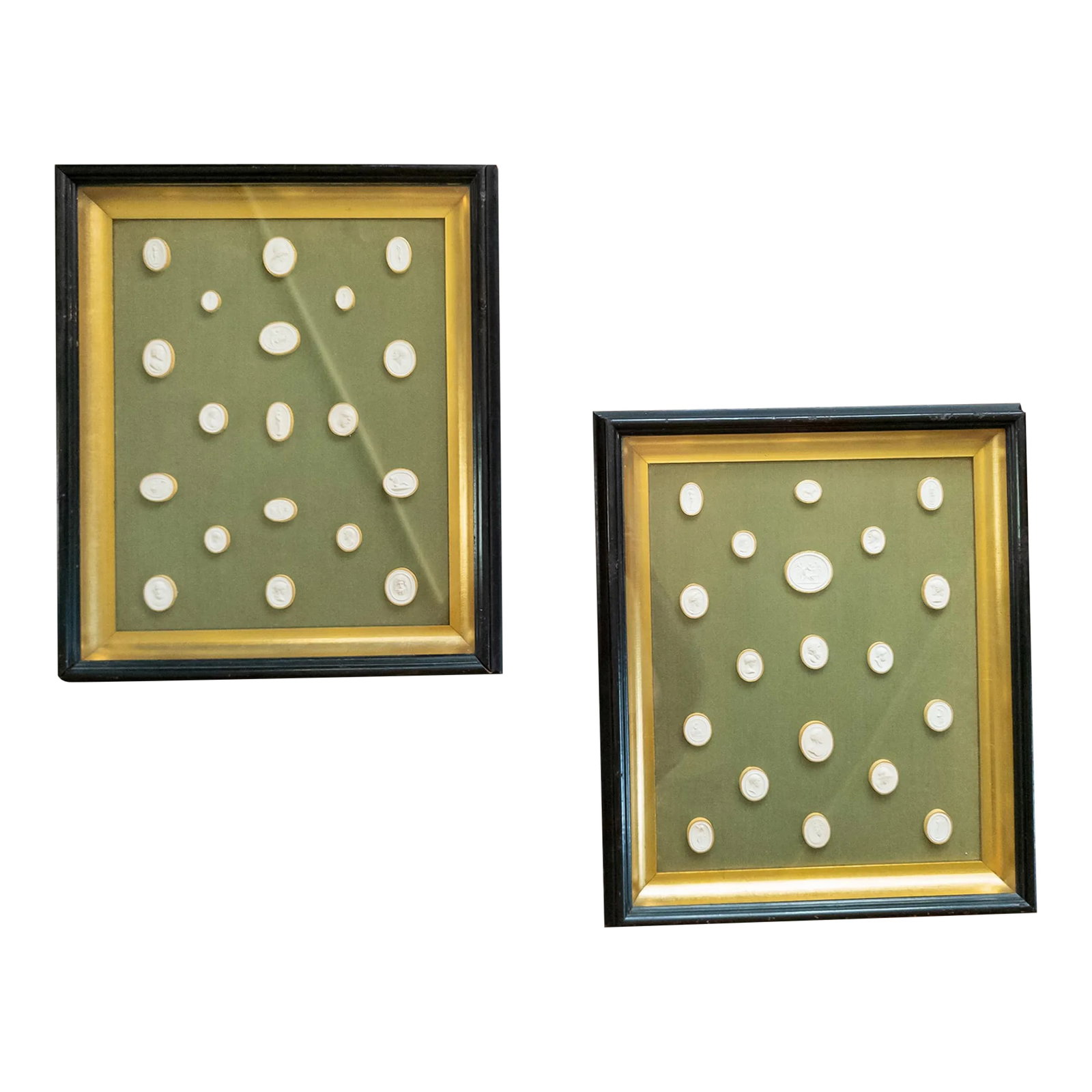 19th Century Framed Set of Italian Grand Tour Intaglios in Shadow Boxes: We are selling this great pair of framed Neo-Classical Intaglios. These two cases have elegantly arranged plaster Intaglios on a green background in shadowbox. The backs have provenance of James