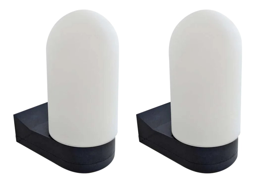 1970s German Wall Lights - a Pair: A pair of modernist 1970s German sconces with black PVC frames and white frosted dome glass shades. Rewired. Condition: Alterations: Restored Imperfections: Some Imperfections Condition Notes: