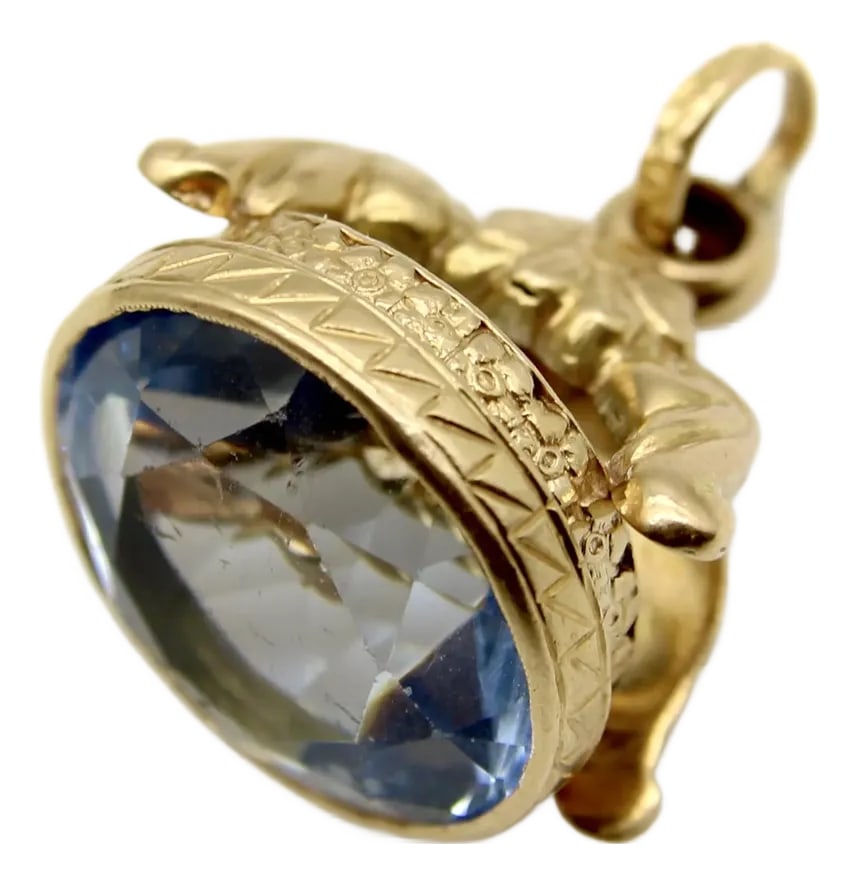 Vintage 14k Gold Italian Fob With Blue Paste Stone: This vintage 14k gold fob features a beautifully faceted, saturated blue paste stone. The top of the fob consists of a central flower that cascades into two leaf-like elements. At the base, a border
