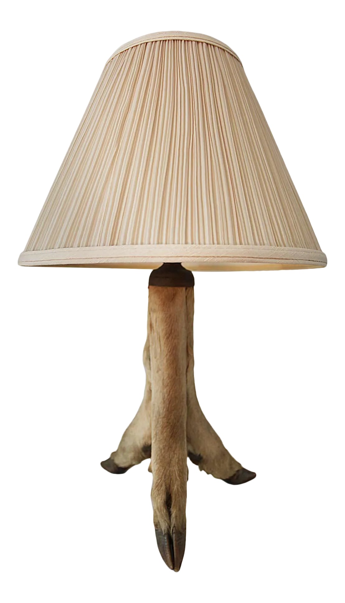 Table Lamp: Vintage taxidermy deer hoof table lamp features a rustic tripod base made from hooves and lower leg bones paired with a pleated, cone-shaped fabric shade. Circa 1960's - 1970's. Condition: