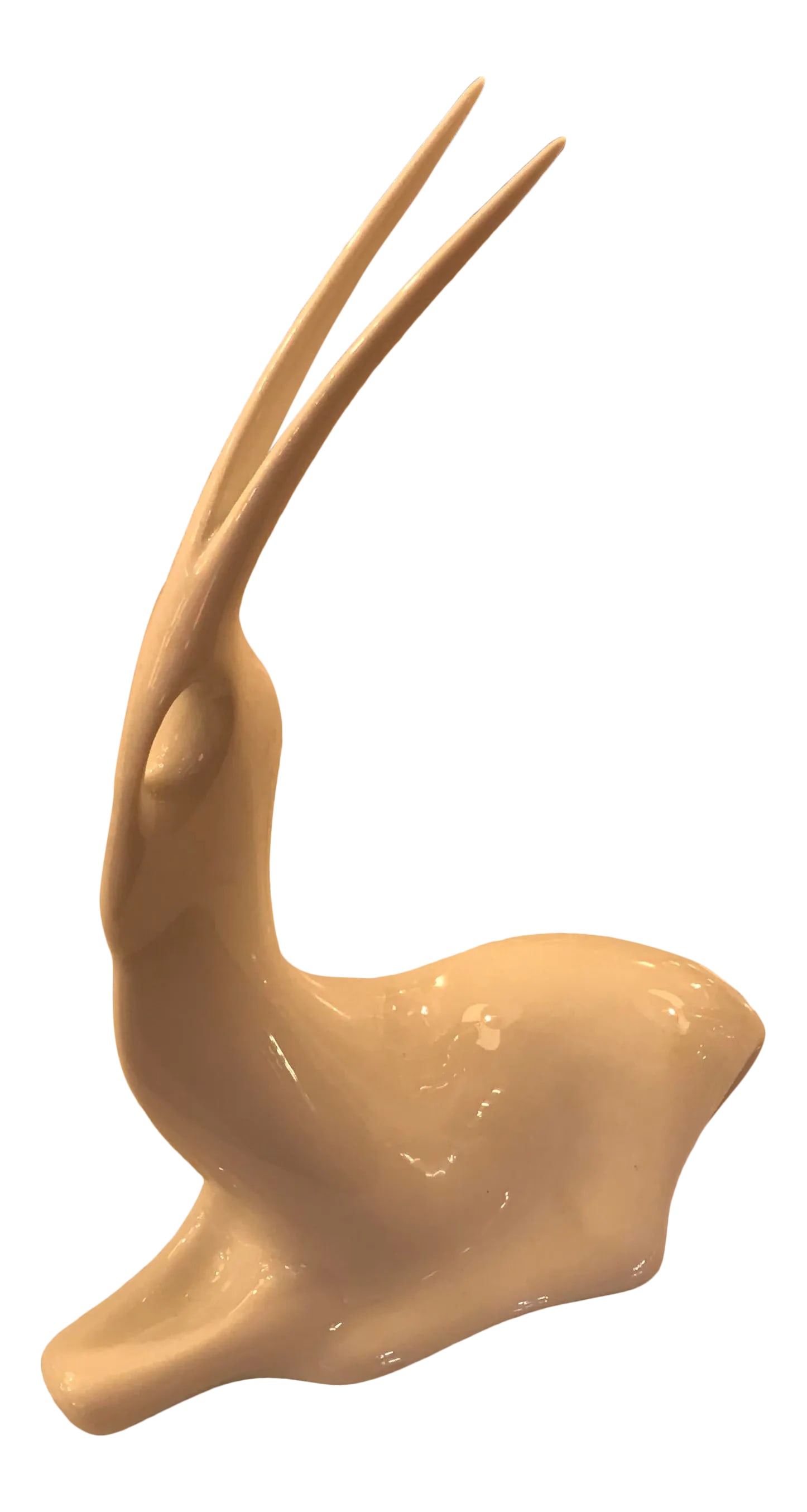 Art Deco White Porcelain Resting Gazelle: Beautiful Art Deco porcelain gazelle in repose. In a very elegant stance, this beautiful animal is a delicate work of art and can be displayed on its own or with other beautifully made animals or