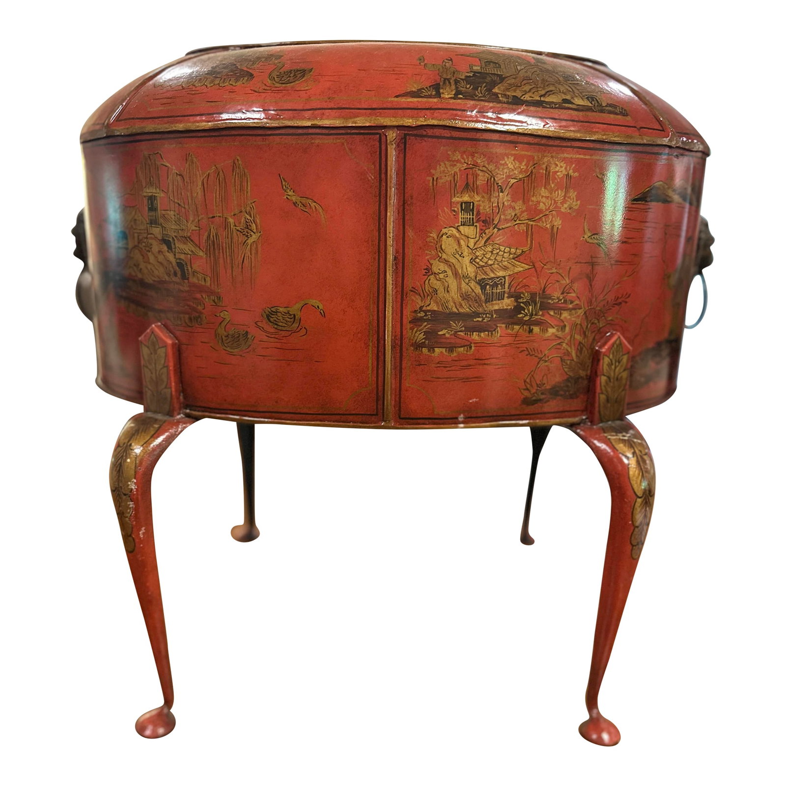 1990s Theodore Alexander Red Tole Chinoiserie Planter: This Stunning Vintage Red Tole Planter by Theodore Alexander Furniture Comapny is painted with Chinoiserie birds, pagodas and garden scenes and features bronze lion heads on each side. Designed to