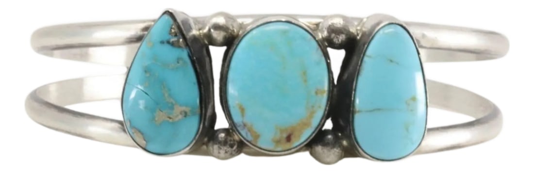 Navajo Sterling Silver Kingman Turquoise Bracelet Cuff by Augustine Largo: Navajo Sterling Silver Kingman Turquoise Three-Stone Bracelet Cuff by Augustine Largo Highlight your collection with this handcrafted Navajo bracelet cuff by renowned silversmith Augustine Largo.