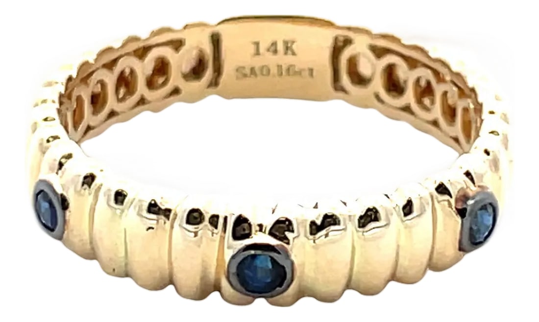 14k Yellow Gold Sapphire Band Ring, Size 6.75: Elegant 14k yellow gold band ring accented with three round blue sapphires totaling approximately 0.16 carats. Ring size 6.75. Total weight 2.3 grams. A refined, low-profile design that's easy to