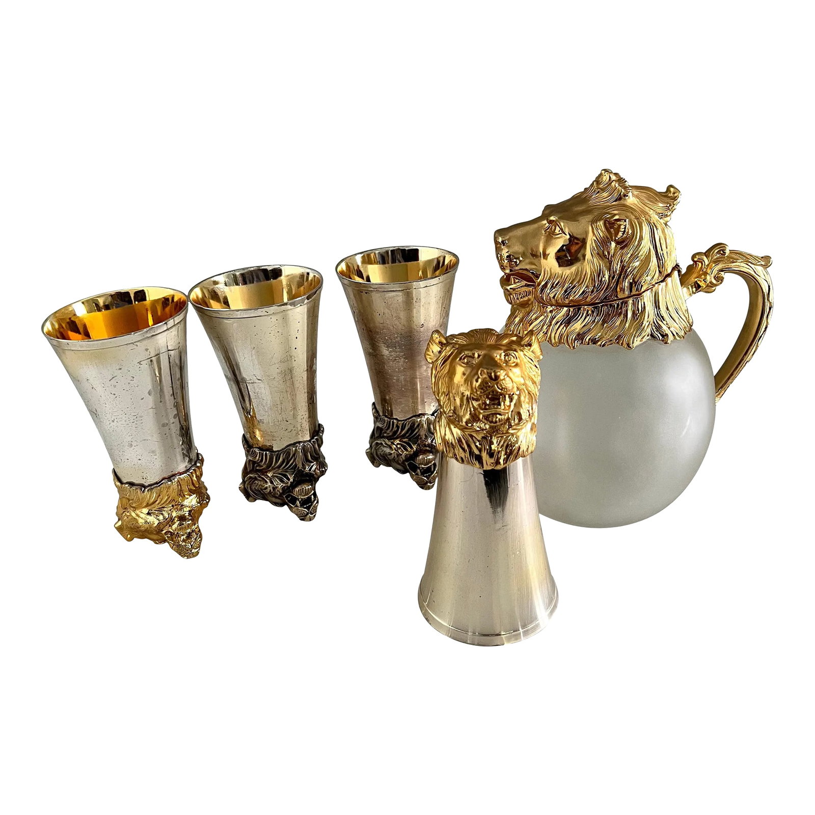 Mid 20th Century Lion Stirrup Cups with Lion Head Pitcher - Set of 5: In the Style of Gucci and Ralph Lauren we have four lion stirrup cups and a lion head pitcher of frosted bulb glass. The cups have different finishes, but we feel like this patination adds to the uniq