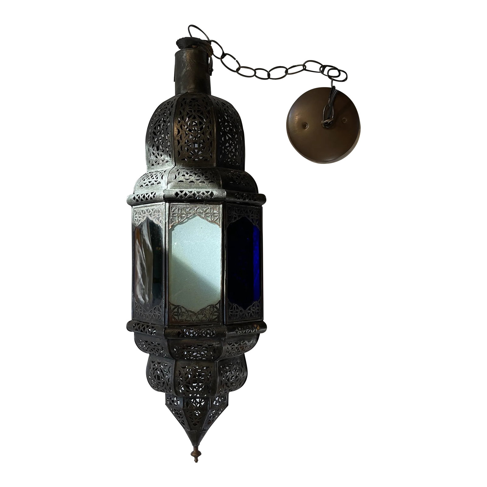 Late 20th Century Moroccan Handcrafted Pendant Light With Multi Color Glass Panels: This is a very fun, decorative and colorful handmade pendant light from Morocco that is 8 sided with multi color glass panels. One panel is red, blue, green and amber. The other four panels are