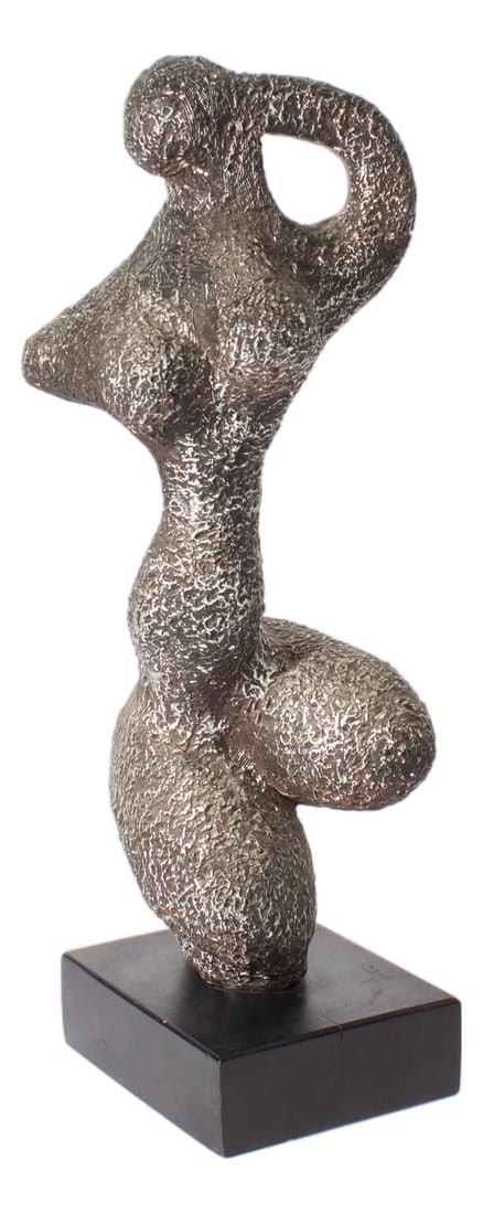 1972 Abstract Sculpture of a Nude Figure by Austin Productions: A 1972 sculpture of a nude figure produced by Austin Productions. This sculpture is an abstract form of a nude woman, posing with one leg up and an arm reaching up to her head. Attached to a black