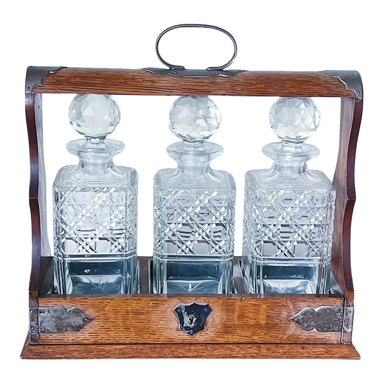 Antique Oak & Brass Tantalus With Set of 3 Whiskey or Liqueur Crystal Decanters With Key: Antique Oak & Brass Tantalus with Set of 3 Whiskey or Liqueur Crystal Decanters Antique tantalus holding three crystal bottles with key *For those who did not yet know, these striking 'drinks
