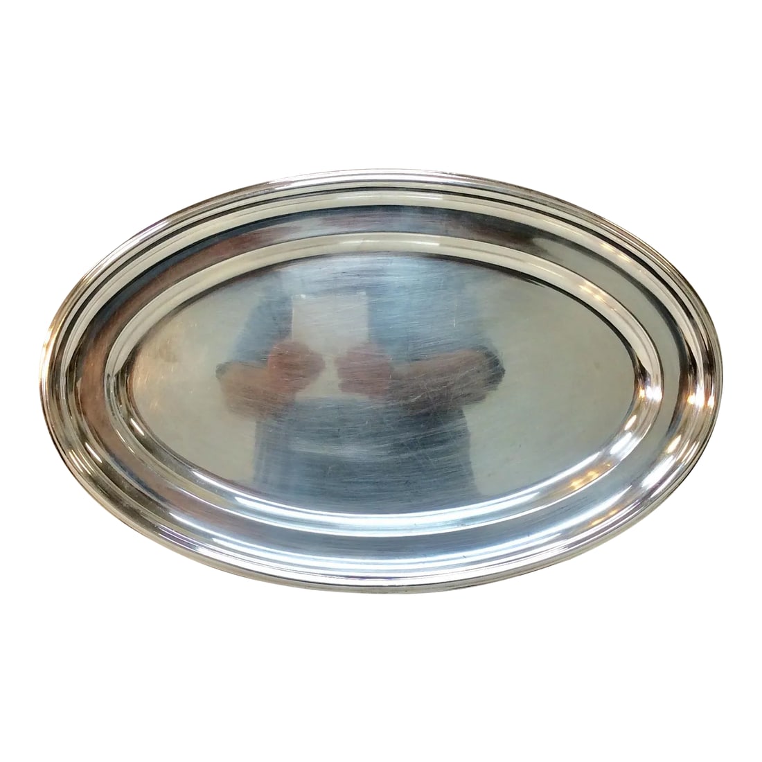 Early 20th Century French Hotel Silver Silverplate Serving Platter: This Early 20th Century French Hotel Silver Silverplate Serving Platter is hallmarked with small symbols on the underside. Having a classic oval shape these pieces were made extra dense and heavy.